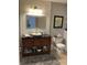 Updated bathroom with granite countertop vanity, modern lighting, and stylish gray shiplap accent wall at 7357 Lake Lakota Dr, Indianapolis, IN 46217