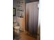 Bathroom featuring a shower with a neutral shower curtain and decor shelves at 7357 Lake Lakota Dr, Indianapolis, IN 46217