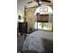 Well-lit bedroom featuring a four-poster bed and sunny window with a unique design at 7357 Lake Lakota Dr, Indianapolis, IN 46217