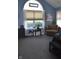 Bright primary bedroom with ample natural light and a cozy sitting area at 7357 Lake Lakota Dr, Indianapolis, IN 46217