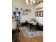 Charming dining room featuring a decorative rug, modern table setting and rustic decorative wall shelves at 7357 Lake Lakota Dr, Indianapolis, IN 46217