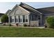 Elegant brick home with lush green lawn, beautiful arched window, and inviting outdoor space at 7357 Lake Lakota Dr, Indianapolis, IN 46217