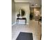 Inviting hallway with stylish decor, tile floors, and views into other areas of the home at 7357 Lake Lakota Dr, Indianapolis, IN 46217