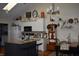 Bright kitchen featuring white cabinets, granite countertops, island with seating, and modern appliances at 7357 Lake Lakota Dr, Indianapolis, IN 46217