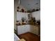 Kitchen featuring white cabinets, granite countertops, and unique décor at 7357 Lake Lakota Dr, Indianapolis, IN 46217