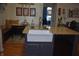 Kitchen island featuring granite countertops and sink with grey cabinets at 7357 Lake Lakota Dr, Indianapolis, IN 46217