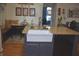 Well-lit kitchen island with a farmhouse sink and granite countertops at 7357 Lake Lakota Dr, Indianapolis, IN 46217