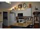 Bright kitchen featuring white cabinets, granite countertops, island with seating, and modern appliances at 7357 Lake Lakota Dr, Indianapolis, IN 46217