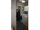 Functional laundry room with modern washer and dryer and stylish floral tiled floors at 7357 Lake Lakota Dr, Indianapolis, IN 46217