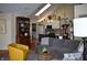 Spacious living room with vaulted ceilings, modern furniture, and seamless flow to the kitchen at 7357 Lake Lakota Dr, Indianapolis, IN 46217