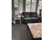 Cozy living room featuring a loveseat, side table and bright natural light from a large window at 7357 Lake Lakota Dr, Indianapolis, IN 46217