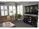 Bright living room featuring a wall of windows with shutters and comfortable seating arrangement at 7357 Lake Lakota Dr, Indianapolis, IN 46217