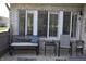 Comfortable patio seating arrangement perfect for relaxing, with a stylish bench, chairs and decorative accents at 7357 Lake Lakota Dr, Indianapolis, IN 46217