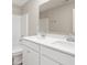 Bright bathroom features double sink vanity with white cabinets and large mirror, plus combined tub and shower at 7510 Hillway Dr, Camby, IN 46113