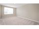 Bright bedroom with neutral paint, carpet and a large window at 7510 Hillway Dr, Camby, IN 46113