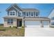 Charming two-story home with a three-car garage and well-maintained front yard at 7510 Hillway Dr, Camby, IN 46113