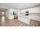 Modern kitchen with stainless appliances, white cabinetry, granite countertops, and a large island at 7510 Hillway Dr, Camby, IN 46113