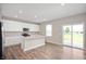 Well-designed kitchen with stainless appliances, granite countertops, and island with seating at 7510 Hillway Dr, Camby, IN 46113