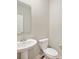 Bright powder room with pedestal sink and toilet at 7510 Hillway Dr, Camby, IN 46113