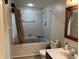 Bathroom featuring an enclosed tub and shower, toilet, sink, and framed mirror at 7667 Madden Ln, Fishers, IN 46038