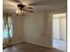 Bedroom with a window, closet, and a ceiling fan at 7667 Madden Ln, Fishers, IN 46038