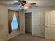 This bedroom features a window and large closet with a chandelier hanging from the ceiling at 7667 Madden Ln, Fishers, IN 46038