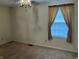 Bedroom featuring carpet floors and a window with blinds and curtains at 7667 Madden Ln, Fishers, IN 46038