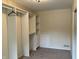 Walk-in closet featuring built-in shelving and a clothes rack at 7667 Madden Ln, Fishers, IN 46038