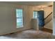 Entry way with blue front door, chandelier and stairway at 7667 Madden Ln, Fishers, IN 46038