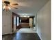 Open concept Living Room leading to a kitchen with dark red accent walls at 7667 Madden Ln, Fishers, IN 46038
