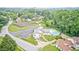 Aerial view showcasing a community pool, tennis courts, and manicured grounds at 7724 Eagle Valley Pass, Indianapolis, IN 46214