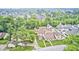 An aerial view displays the property's location amidst lush greenery and surrounding residences at 7724 Eagle Valley Pass, Indianapolis, IN 46214