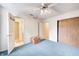 Bright bedroom with blue carpet, ceiling fan, closet at 7724 Eagle Valley Pass, Indianapolis, IN 46214