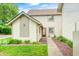 Inviting home exterior with a well-manicured lawn and a charming red front door at 7724 Eagle Valley Pass, Indianapolis, IN 46214