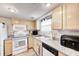 Cozy kitchen featuring granite countertops, ample cabinetry, and modern appliances at 7724 Eagle Valley Pass, Indianapolis, IN 46214