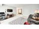 Open-concept living room, featuring comfortable seating and ample natural light at 7724 Eagle Valley Pass, Indianapolis, IN 46214