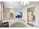 Spacious living area featuring a staircase, fireplace, and open access to the kitchen at 7724 Eagle Valley Pass, Indianapolis, IN 46214