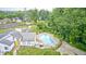 An aerial view features a sparkling blue community pool with lounge chairs at 7724 Eagle Valley Pass, Indianapolis, IN 46214