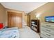 Comfortable bedroom with carpet floor, wood closet, and adjacent to another bedroom at 7831 Bayridge Dr, Indianapolis, IN 46236