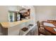 Well-lit kitchen bar with views to dining room at 7831 Bayridge Dr, Indianapolis, IN 46236