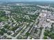 Lush residential area seen from above, showcasing well-maintained homes surrounded by mature trees at 80 Monon Blvd, Carmel, IN 46032