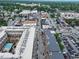 An aerial view of a vibrant downtown district, featuring a mix of commercial and residential buildings at 80 Monon Blvd, Carmel, IN 46032