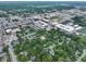 An aerial view of a city showcasing its urban planning with a mix of residential, commercial, and recreational areas at 80 Monon Blvd, Carmel, IN 46032