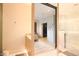 Open bathroom with walk-in shower, vanity, and a glimpse into the bedroom and closet at 80 Monon Blvd, Carmel, IN 46032
