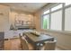Bright dining room with large window, modern table, and stylish decor for elegant meals at 80 Monon Blvd, Carmel, IN 46032