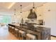 Contemporary kitchen featuring a large island with seating, modern appliances, and ample counter space at 80 Monon Blvd, Carmel, IN 46032