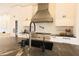 Close-up of a stylish kitchen island with a modern sink, faucet, and stainless steel appliances at 80 Monon Blvd, Carmel, IN 46032