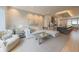 Bright open-concept living room flowing into a modern kitchen with a large island at 80 Monon Blvd, Carmel, IN 46032