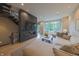 Stylish living room featuring a modern fireplace, staircase, and abundant natural light at 80 Monon Blvd, Carmel, IN 46032
