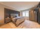 Cozy main bedroom with a neutral palette, textured wall, and ample natural light at 80 Monon Blvd, Carmel, IN 46032